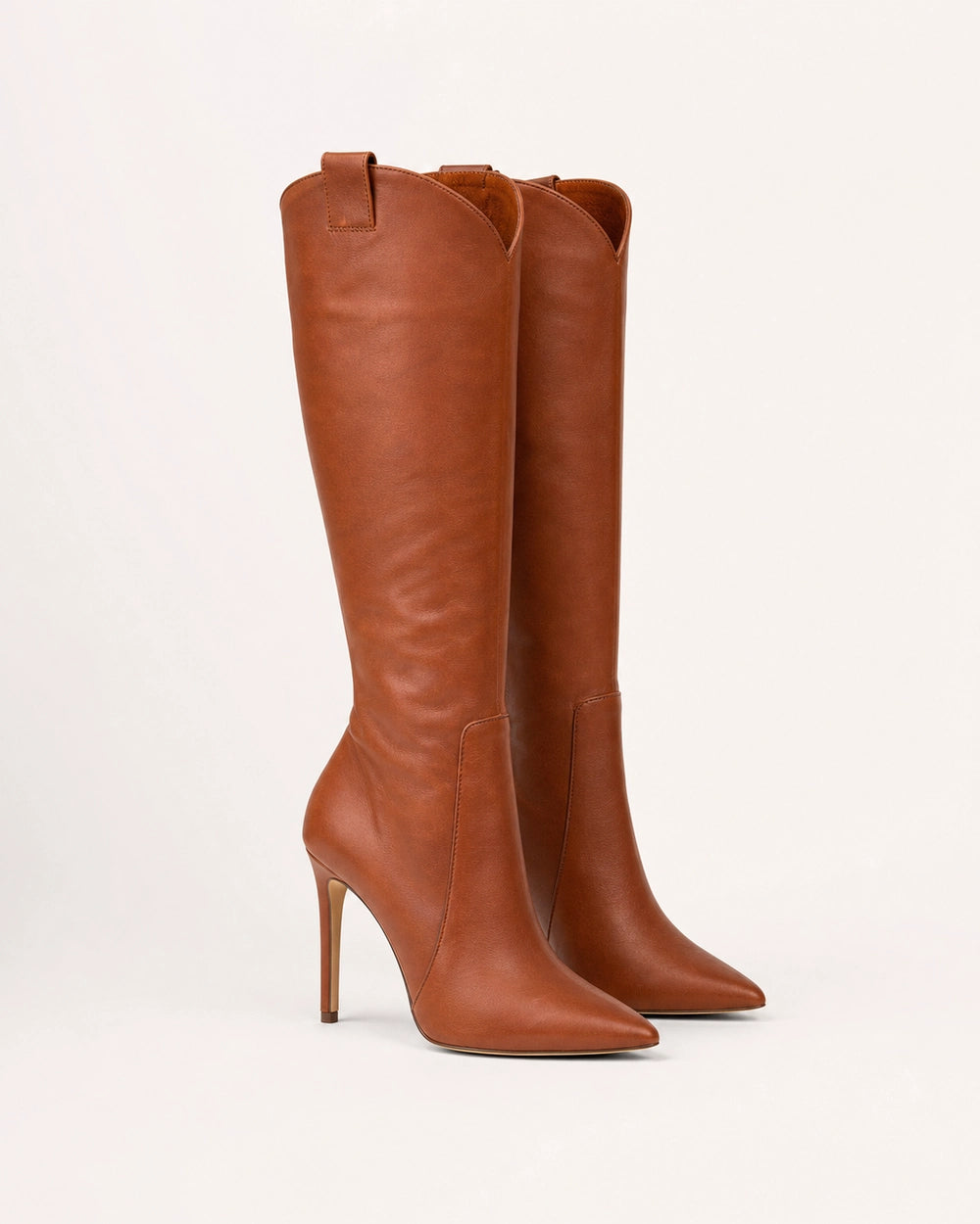 Women's brown leather knee-high stiletto boots, side profile.