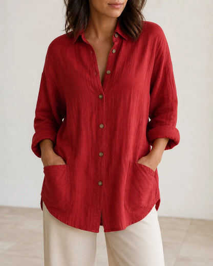 Women's red relaxed longline shirt, front product view.