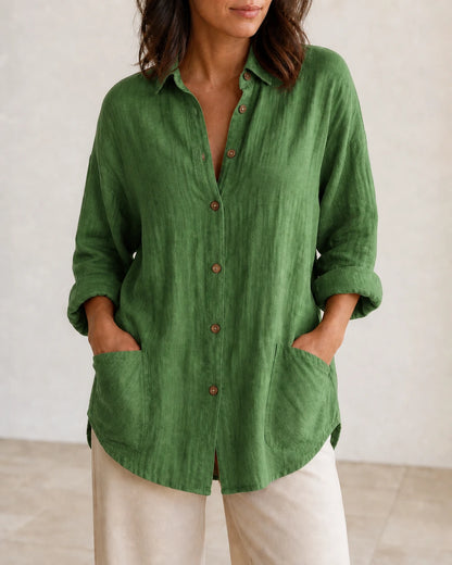 Women's green relaxed longline shirt, front product view.