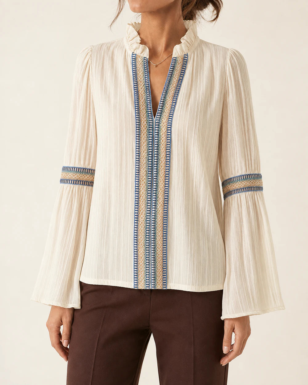 Women's ivory vintage blouse with embroidered trim, straight front fit.