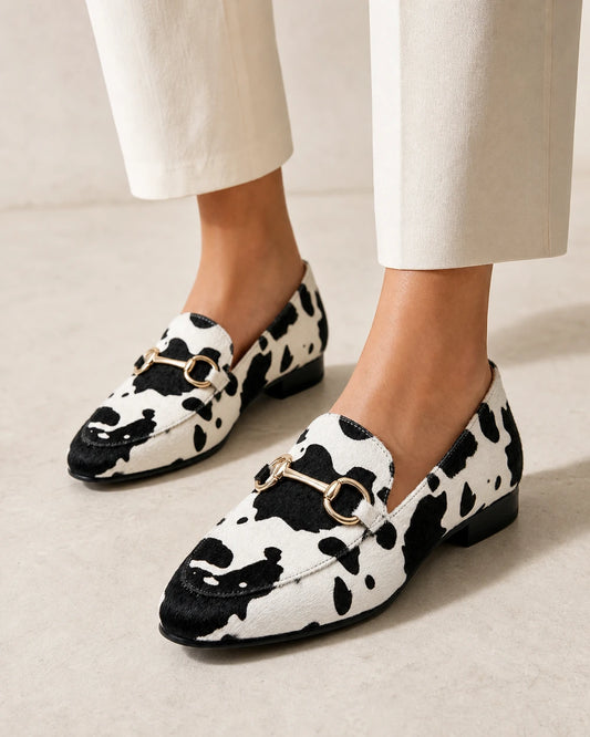 OCTAVIA-QUALITY-REMAKE-2026-07-22 — loafers-for-women-animal-print-slip-on-black-white-01-worn-hero.webp