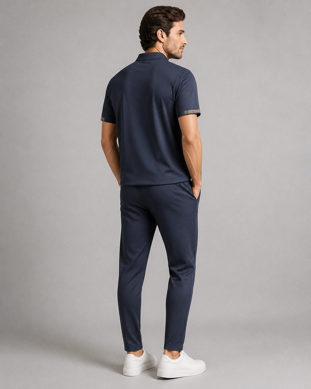 Blue men's polo and trousers set, rear view.
